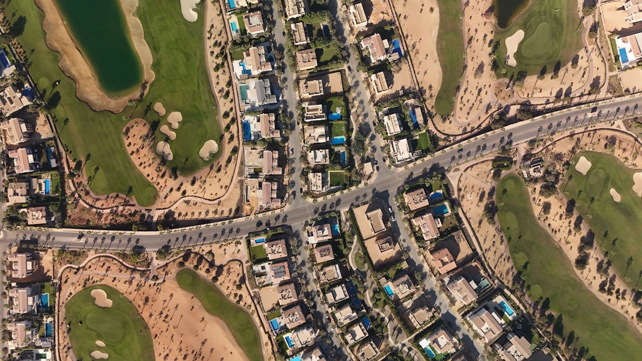 Discover the luxury homes and green golf courses in Sheikh Zayed, Egypt, captured from above.